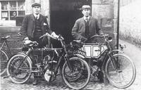 James and John Christie outside their workshop 