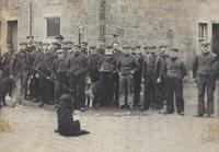 Group of fishermen and their dogs 